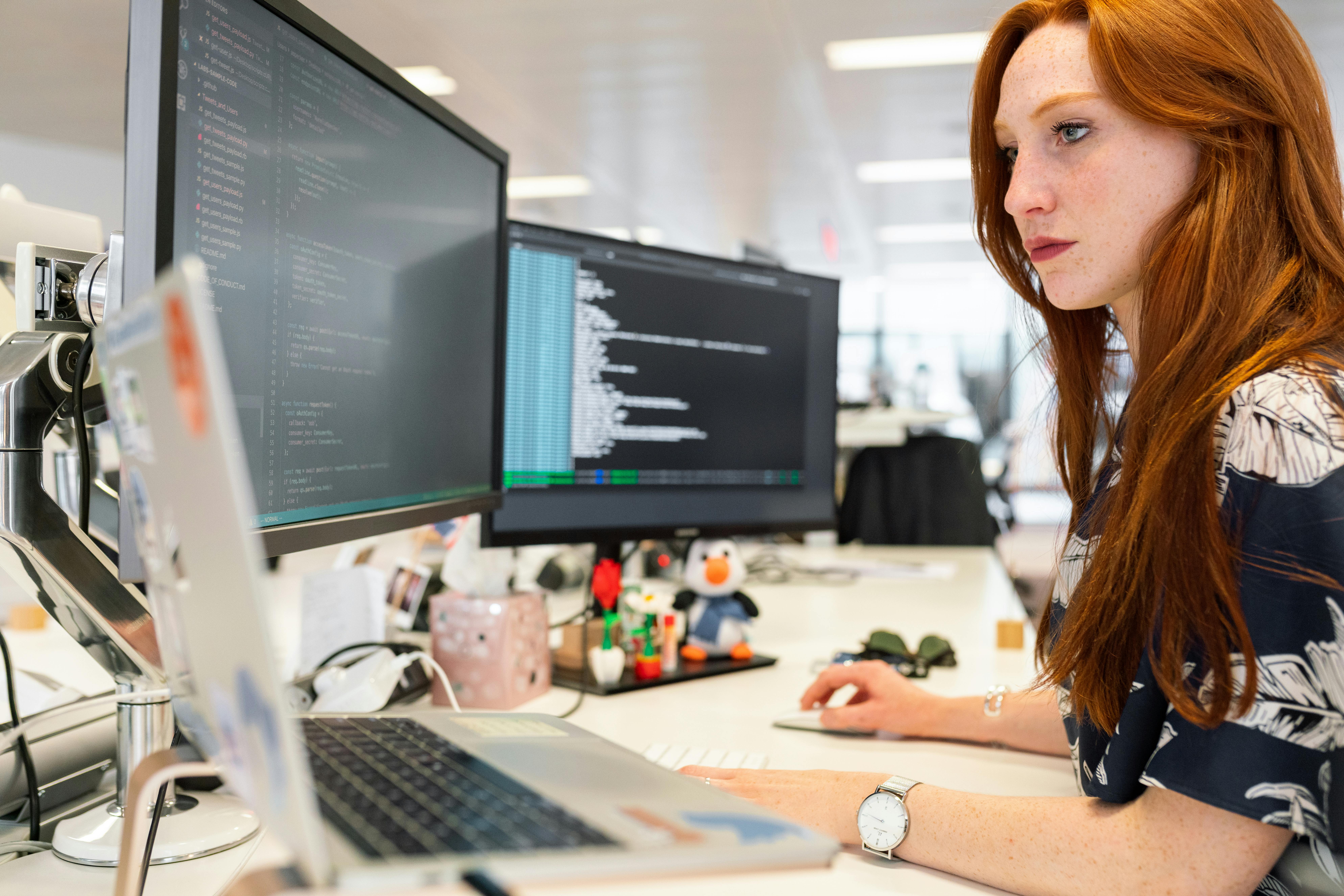 Woman coding at a computer