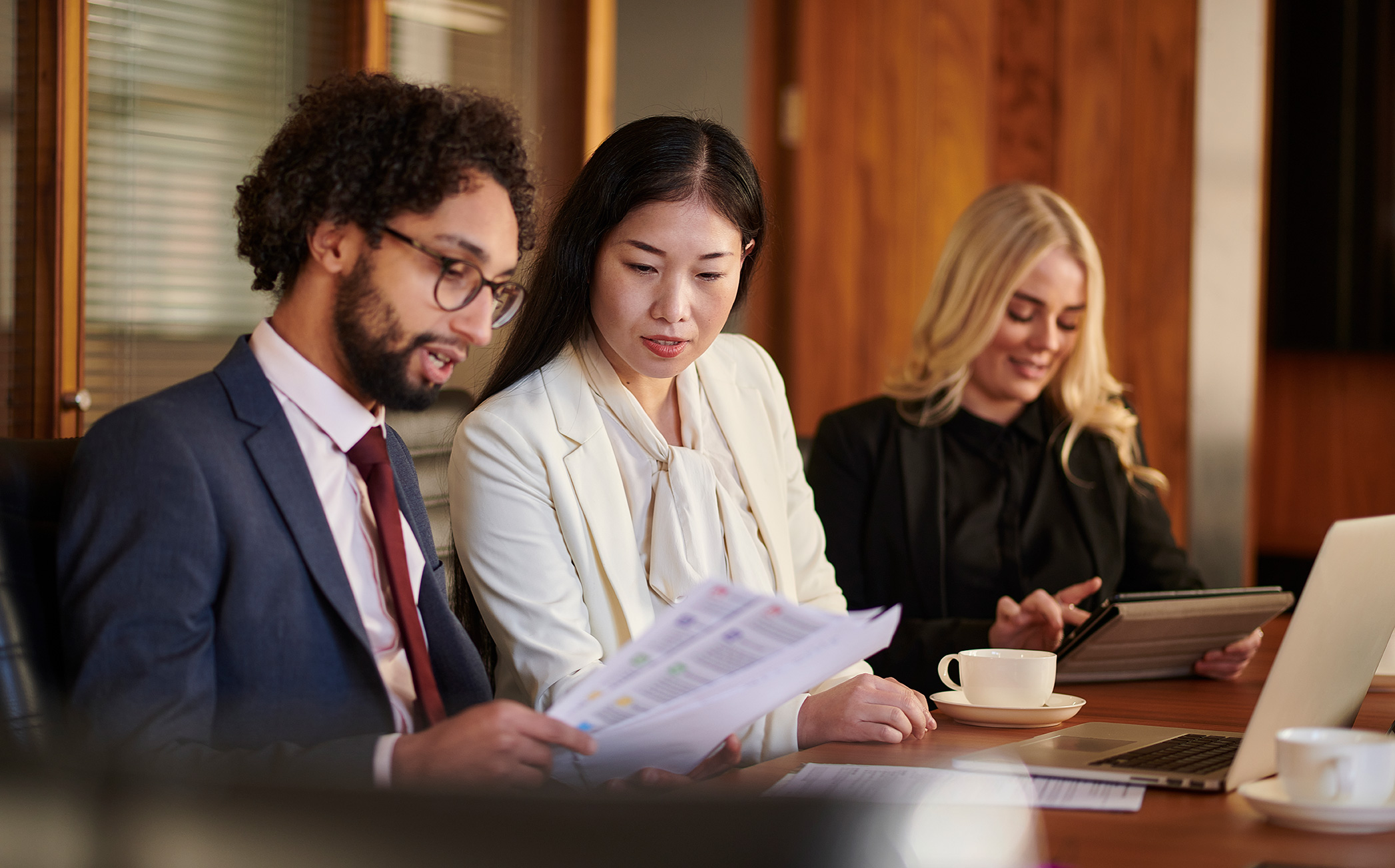 Team members of diverse backgrounds work together