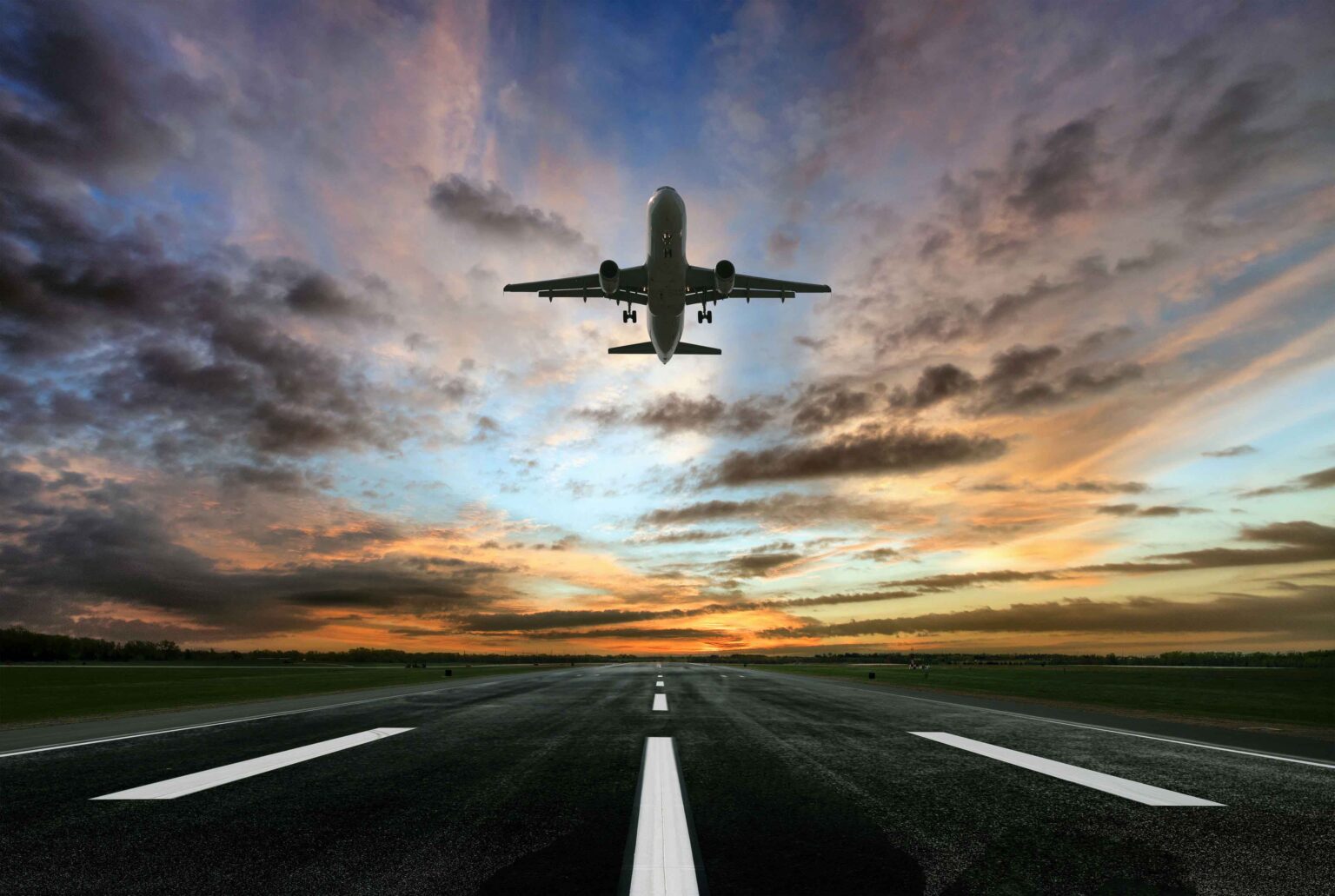 Passenger airplane taking of at sunrise